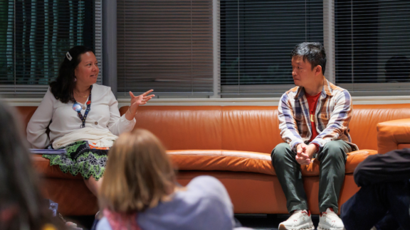 Two people – Dr. Emelihter Kihleng, curator of Pacific Cultures at Te Papa Museum and "Remathau" director Daniel Lin sit on a couch before an audience to discuss the film.