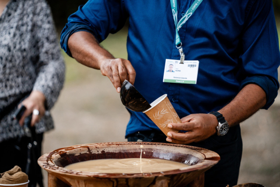 Karl Kuper from the Ministry of the Environment of Solomon Islands mixes kava during an intimate gathering and dialogue in Cali, Colombia at the COP16 Nature House by Project Everyone, in partnership with Nia Tero.